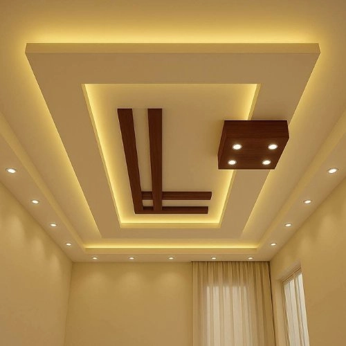 Architect reviewing modern false ceiling layout designs