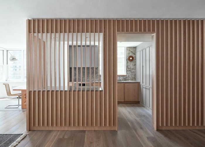 Intricate geometric wooden screen at doorway.