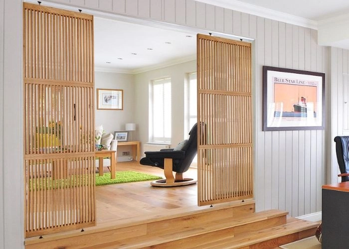 Elegant dark wood partition in a luxury foyer.